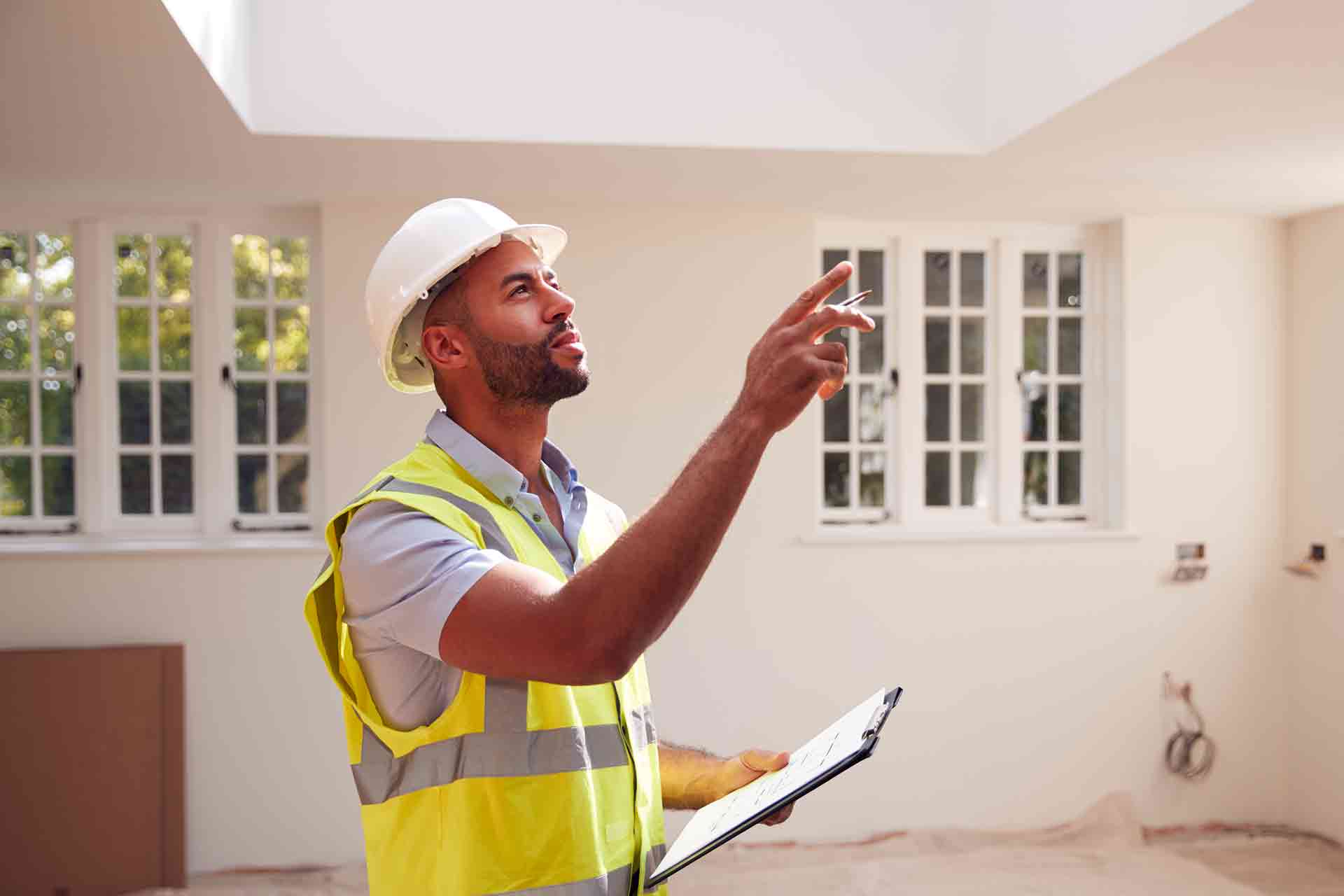 Third Party Wall Surveyors Brighton and Hove reviewing plans between two parties during a dispute